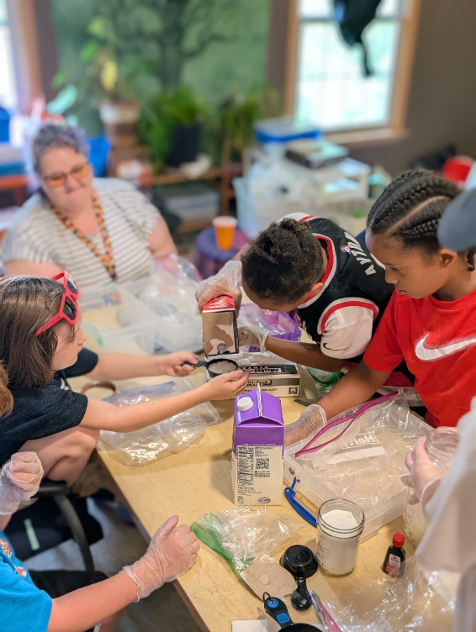 Students measuring and mixing at Slime Lab